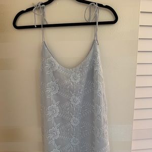 Light blue, embroidered dress.